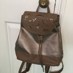 Small silver and gold metallic backpack